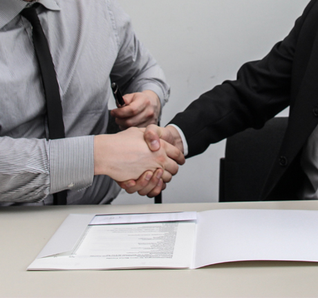 Business Handshake In Office Meeting